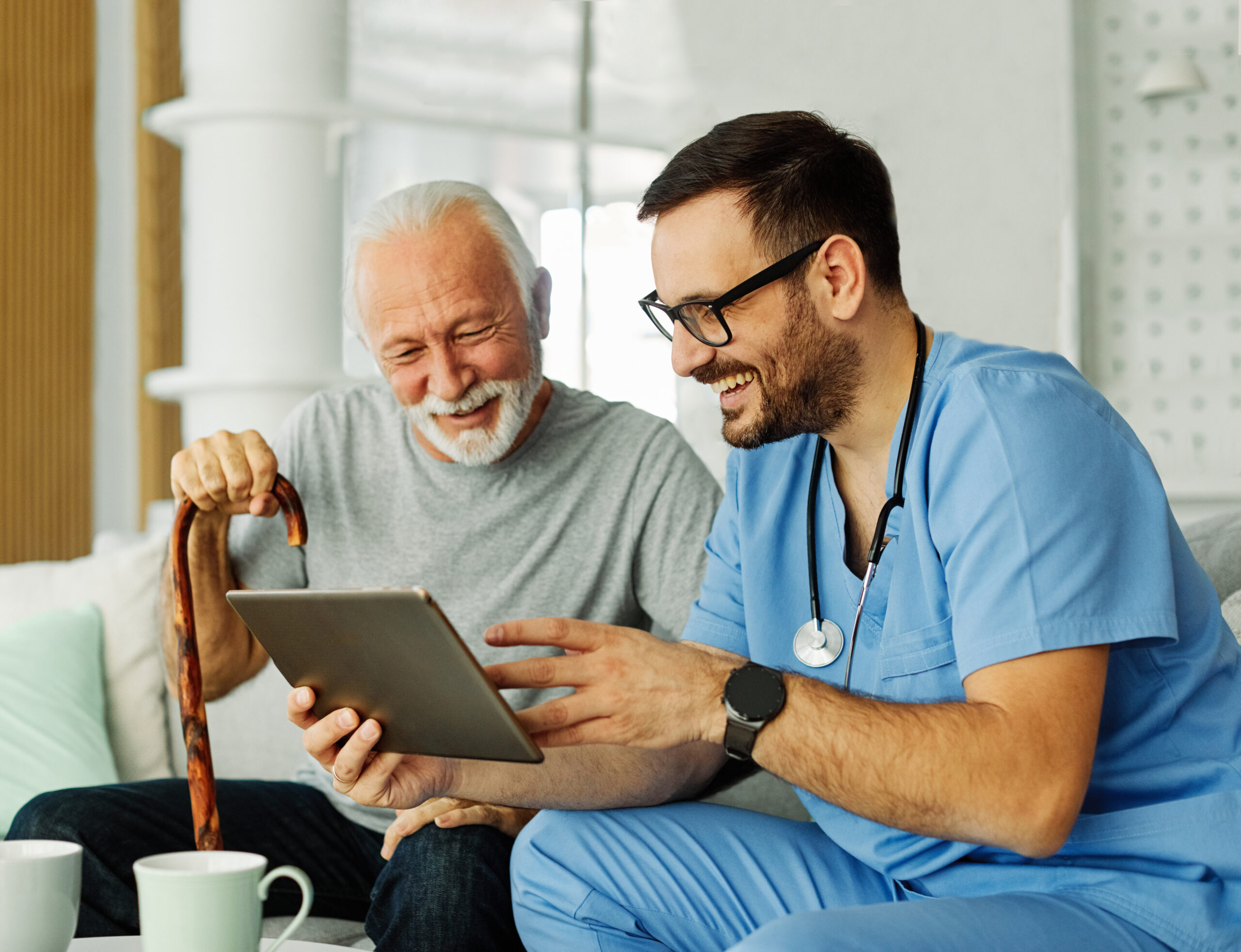 nurse doctor senior care tablet computer technology showing care